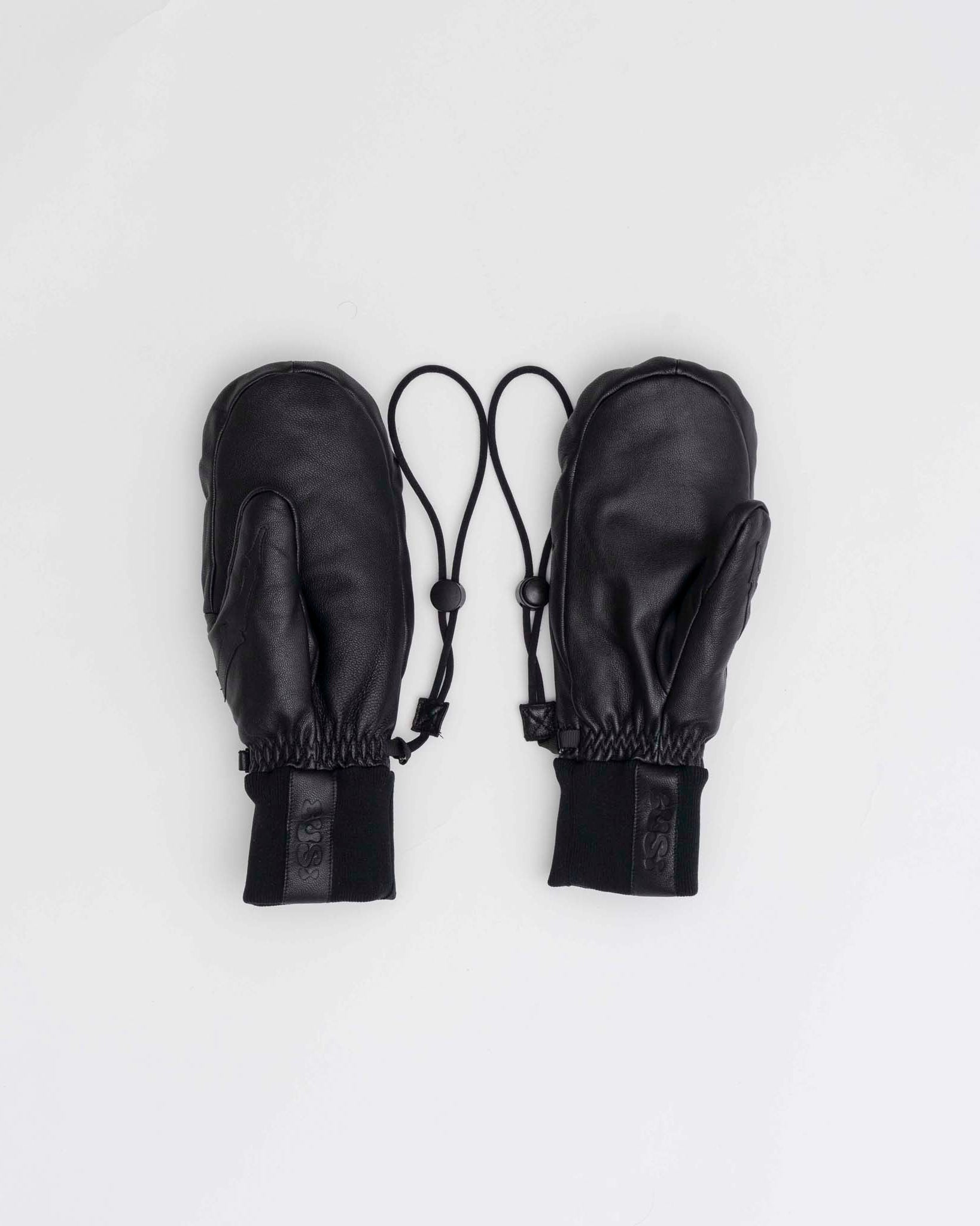 Pair of black leather mittens with drawstrings on a white background
