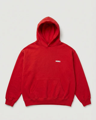 Red hoodie with a small logo on the chest against a light gray background