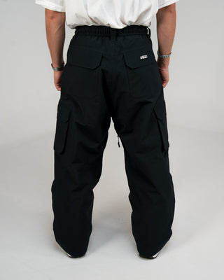 BUSI Biggie Cargo Pant Black snowboard and ski cargo pants, back view on model