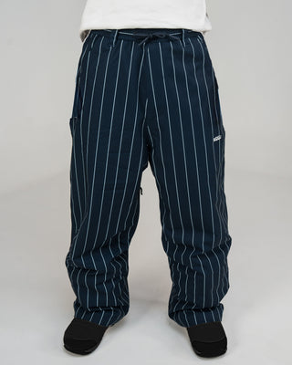 BUSI Biggie Pant Pinstripe snowboard and ski pants, front view on model