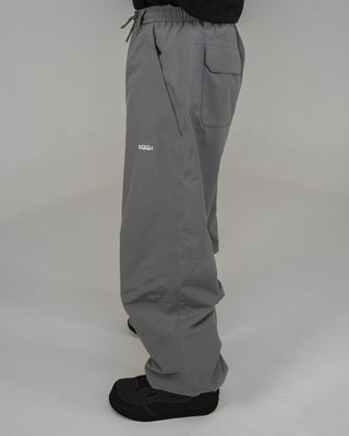 BUSI Biggie Pant Steel Grey snowboard and ski pants, side view on model