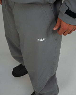 BUSI Biggie Pant Steel Grey snowboard and ski pants, thigh logo detail