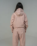 BUSI Core Jacket Dusty Pink snowboard and ski jacket, back view on model