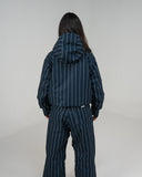 BUSI Core Jacket Pinstripe snowboard and ski jacket, back view on female model