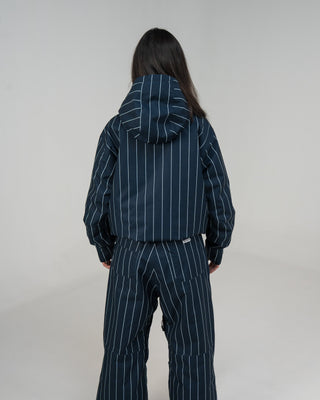 BUSI Core Jacket Pinstripe snowboard and ski jacket, back view on female model