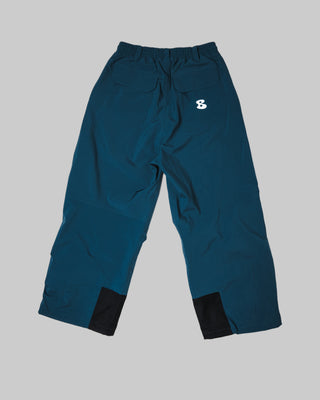 Blue pants with black cuffs on a white background