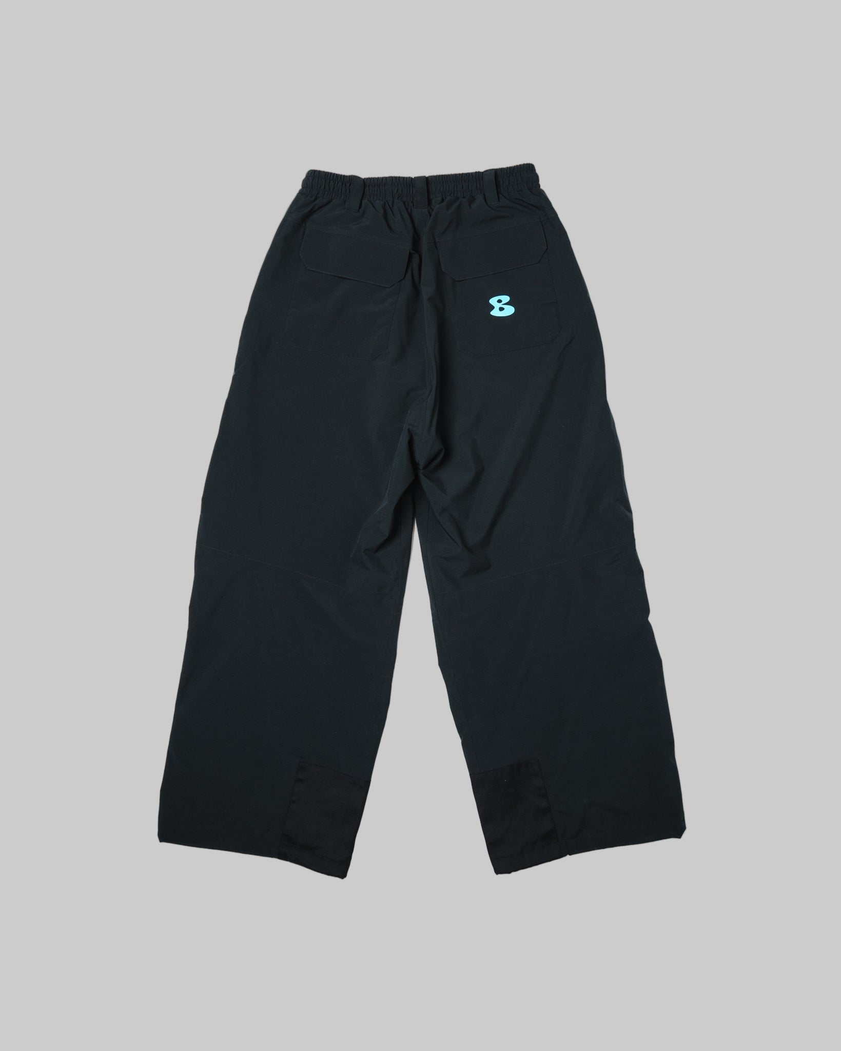 Black pants with a small logo on a white background